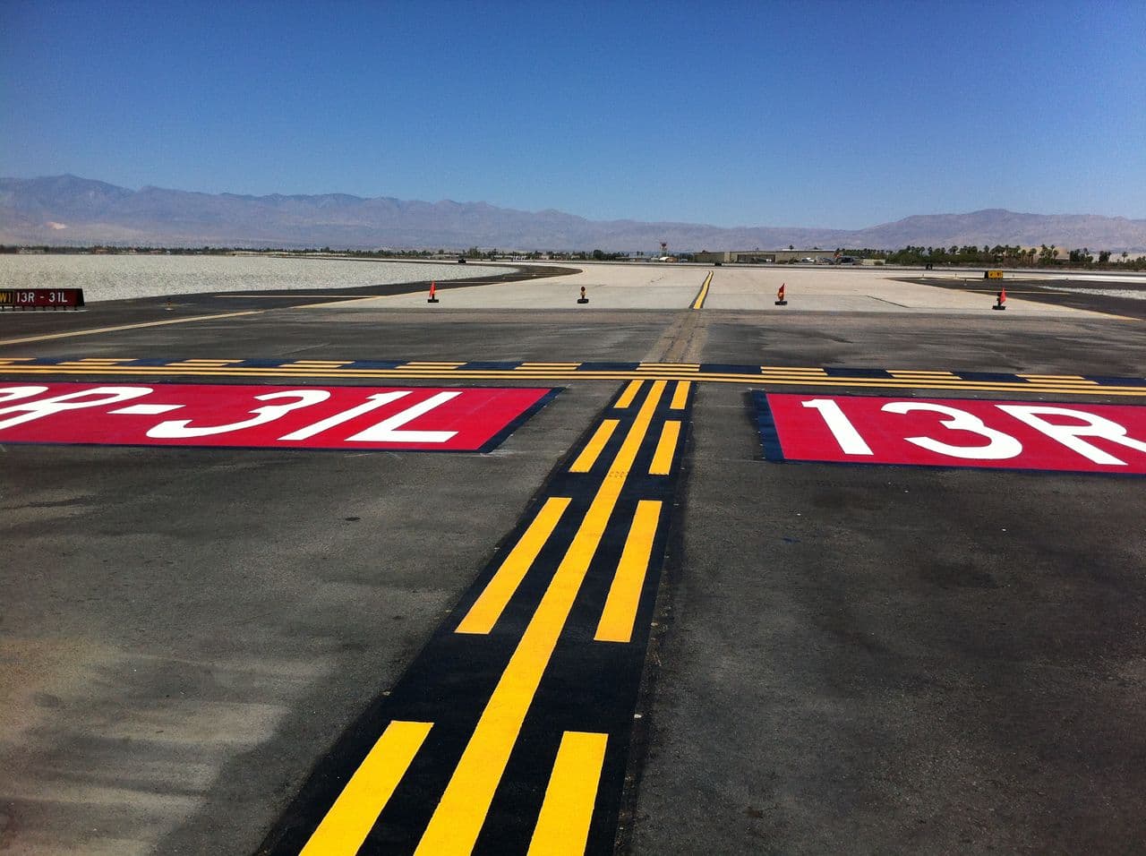 Airport pavement marking at an airside service road in Canada — installed by HUB Surface Systems