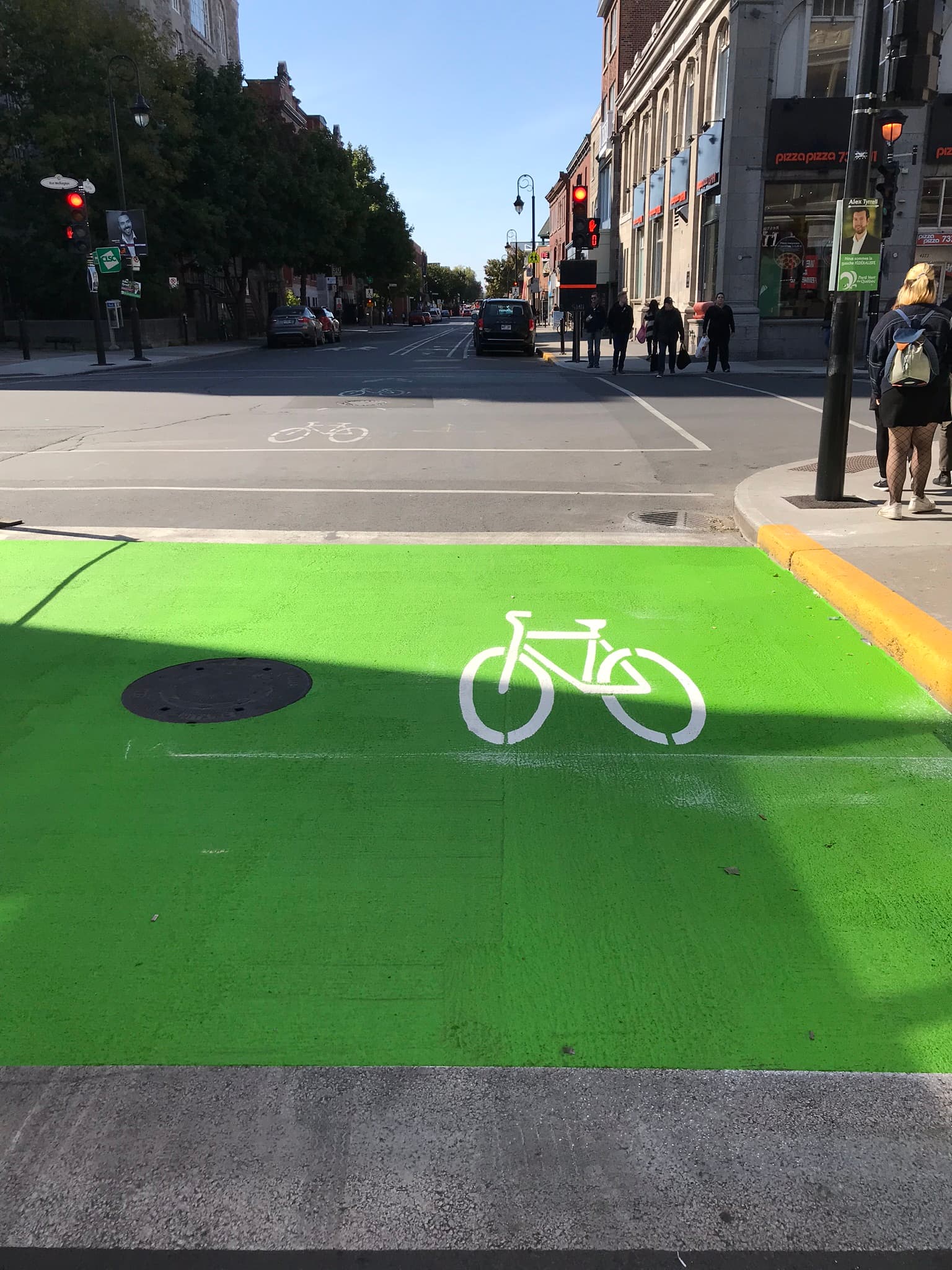 Vivid green protected bike lane — StreetBond coloured cycling infrastructure for Complete Streets Canadian municipality
