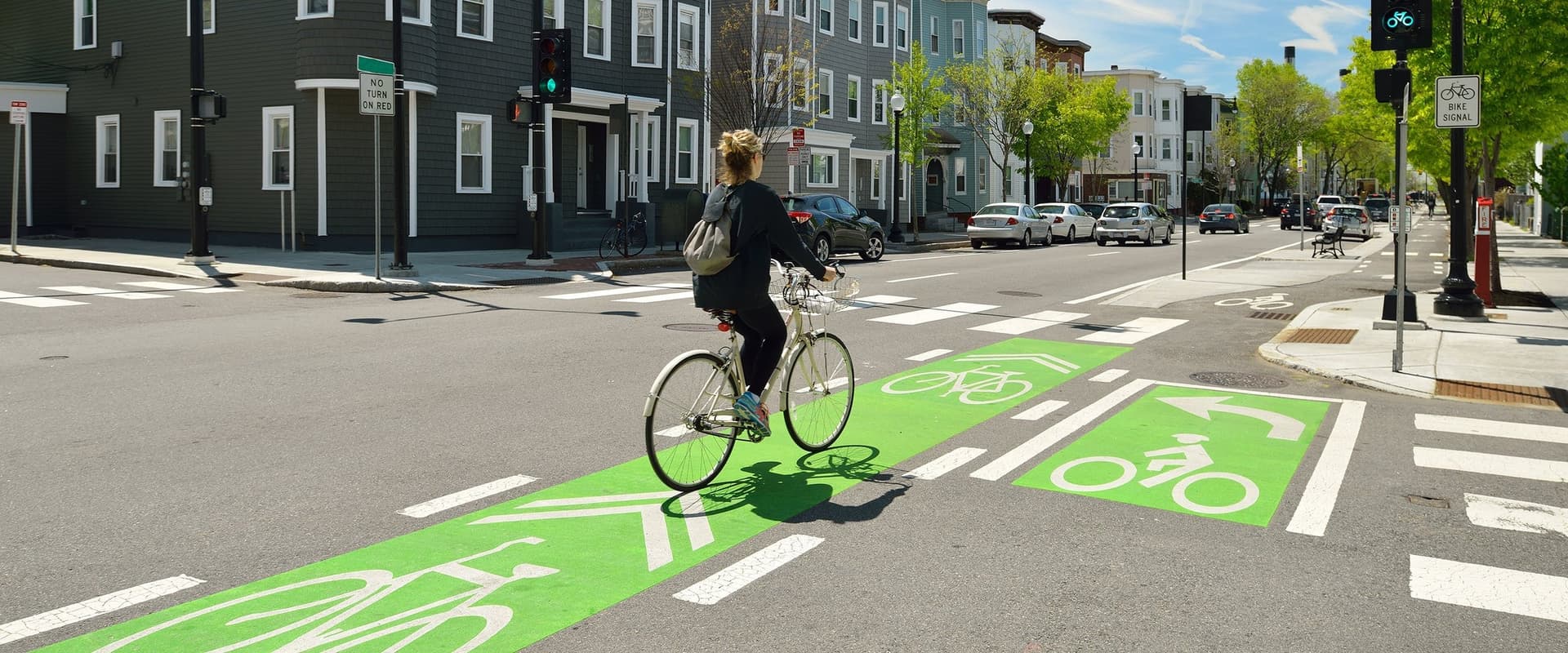 Coloured bike lane at an intersection conflict zone in Canada — installed by HUB Surface Systems