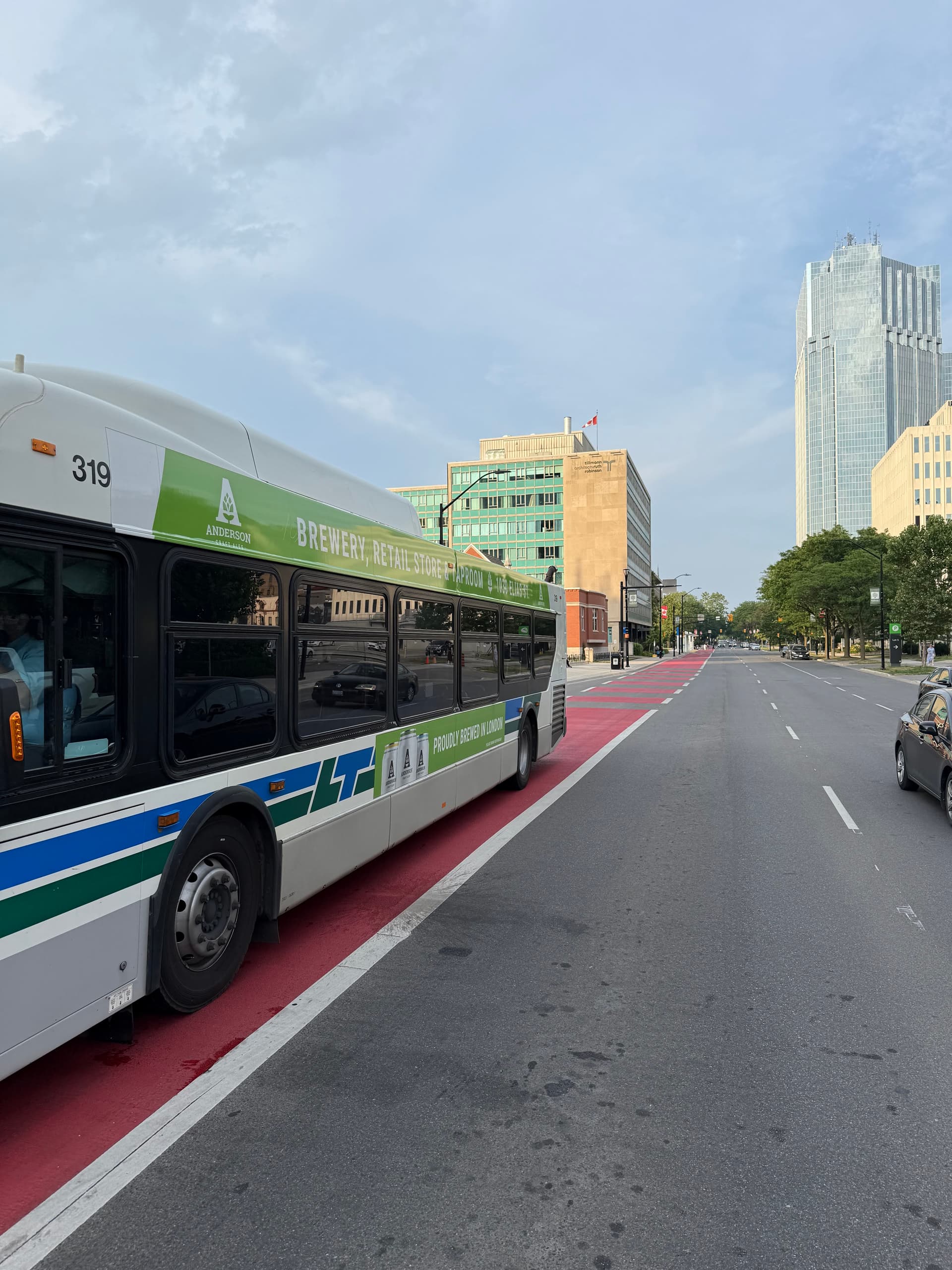 Red MMAX bus rapid transit lane with transit bus — high-durability BRT surface marking for Canadian transit corridor