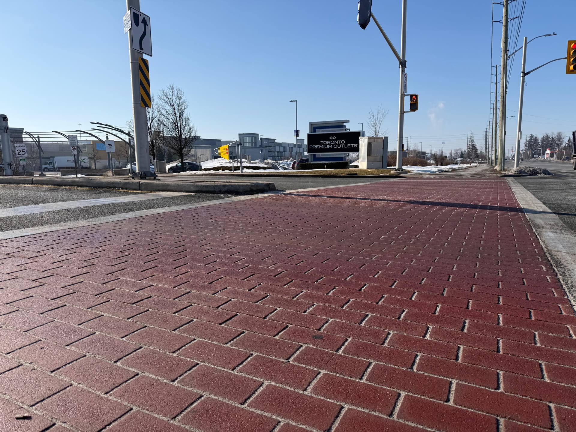 Red brick-pattern crosswalk at the entrance to Toronto Premium Outlets, Halton Hills, Ontario