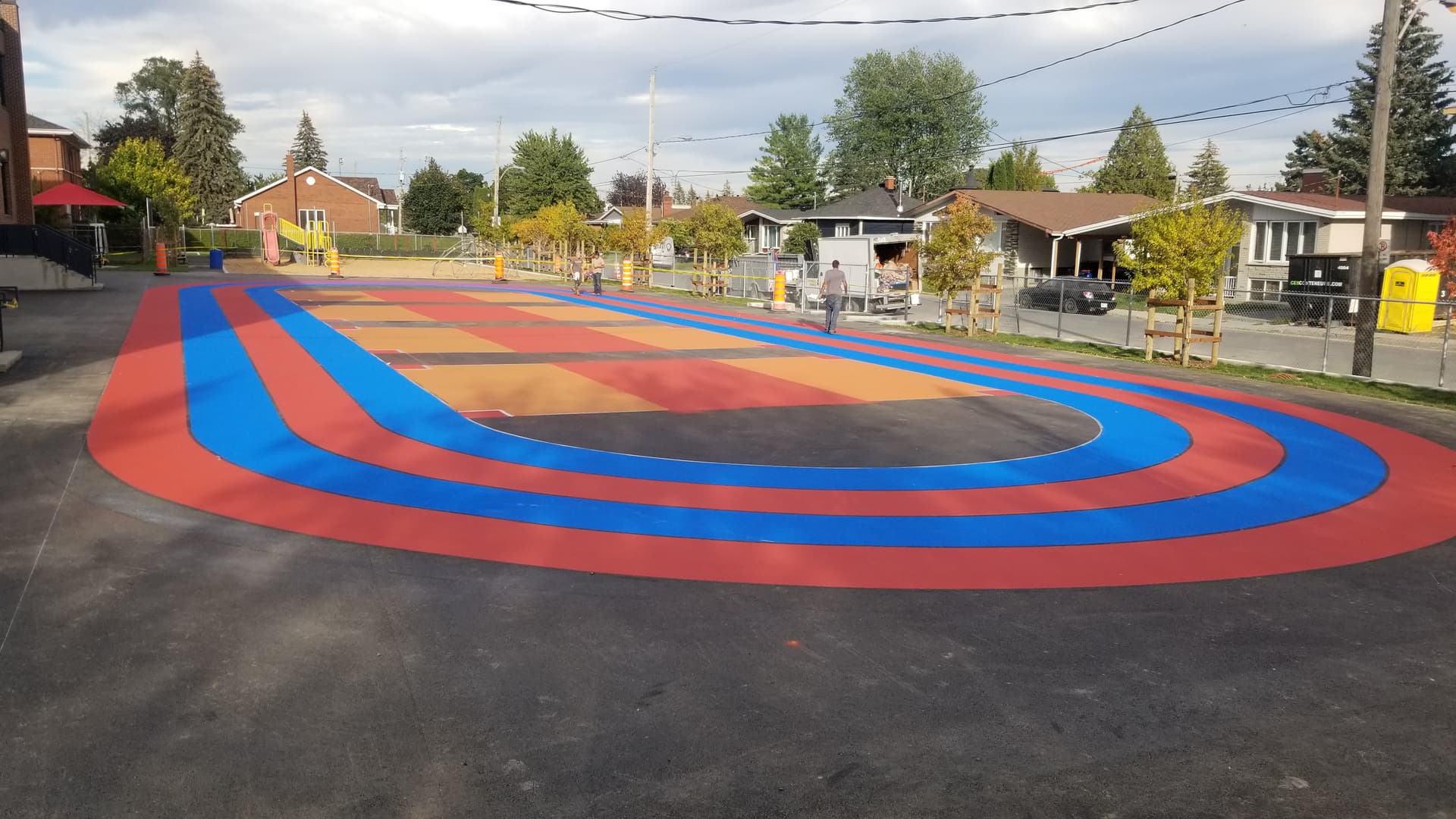 Playground surface graphics installation in Canada: play surfaces and schoolyard games at a schoolyard