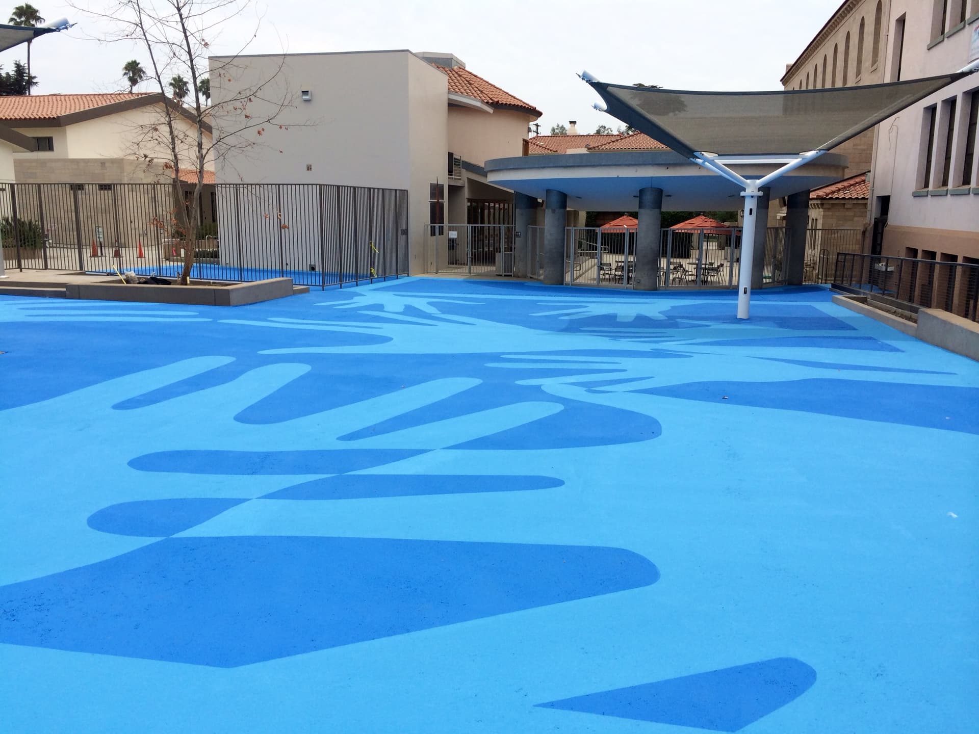 Playground surface graphics installation in Canada: play surfaces and schoolyard games at a daycare courtyard
