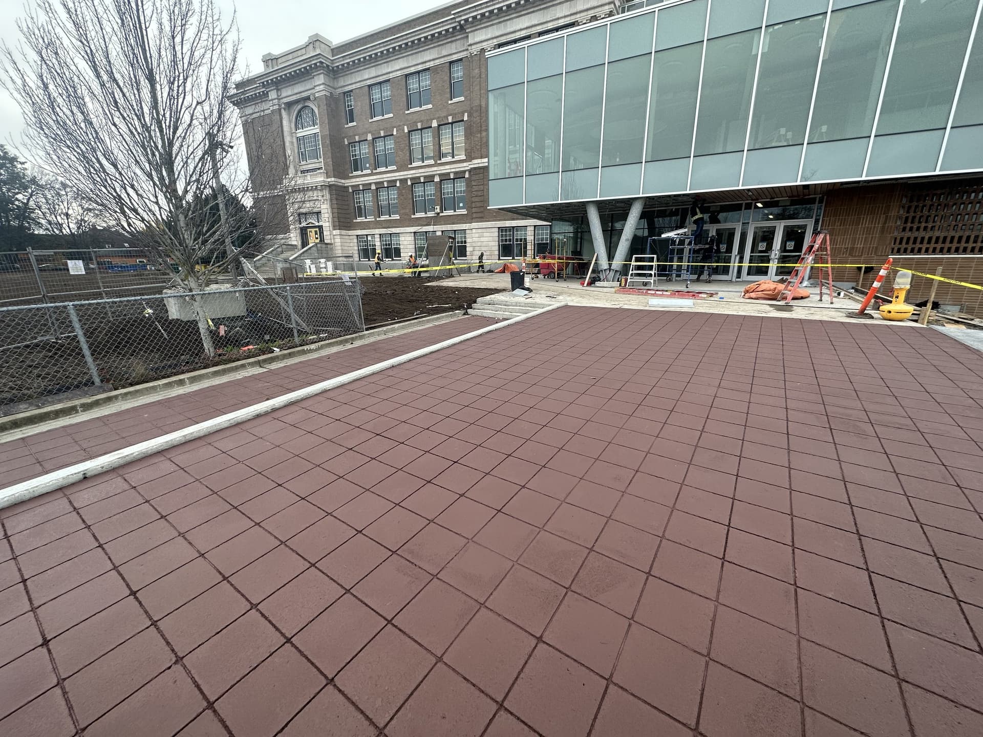 Decorative plaza paving specified for plazas and civic gathering space — a transit plaza