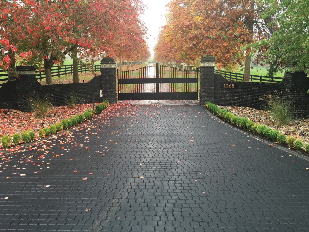 Stamped asphalt driveway at a residential street frontage in Canada — installed by HUB Surface Systems