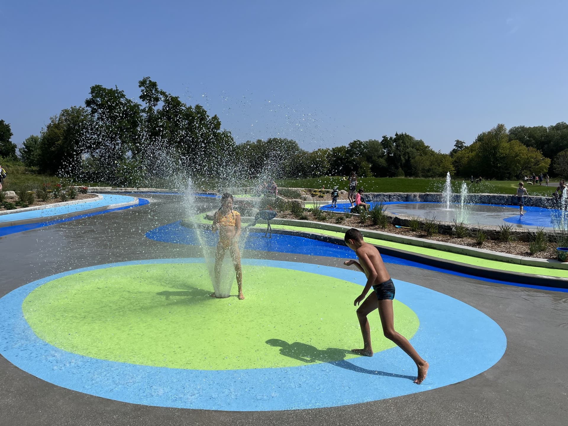 Splash pad surfacing specified for wet play surfaces with slip resistance — a park spray pad