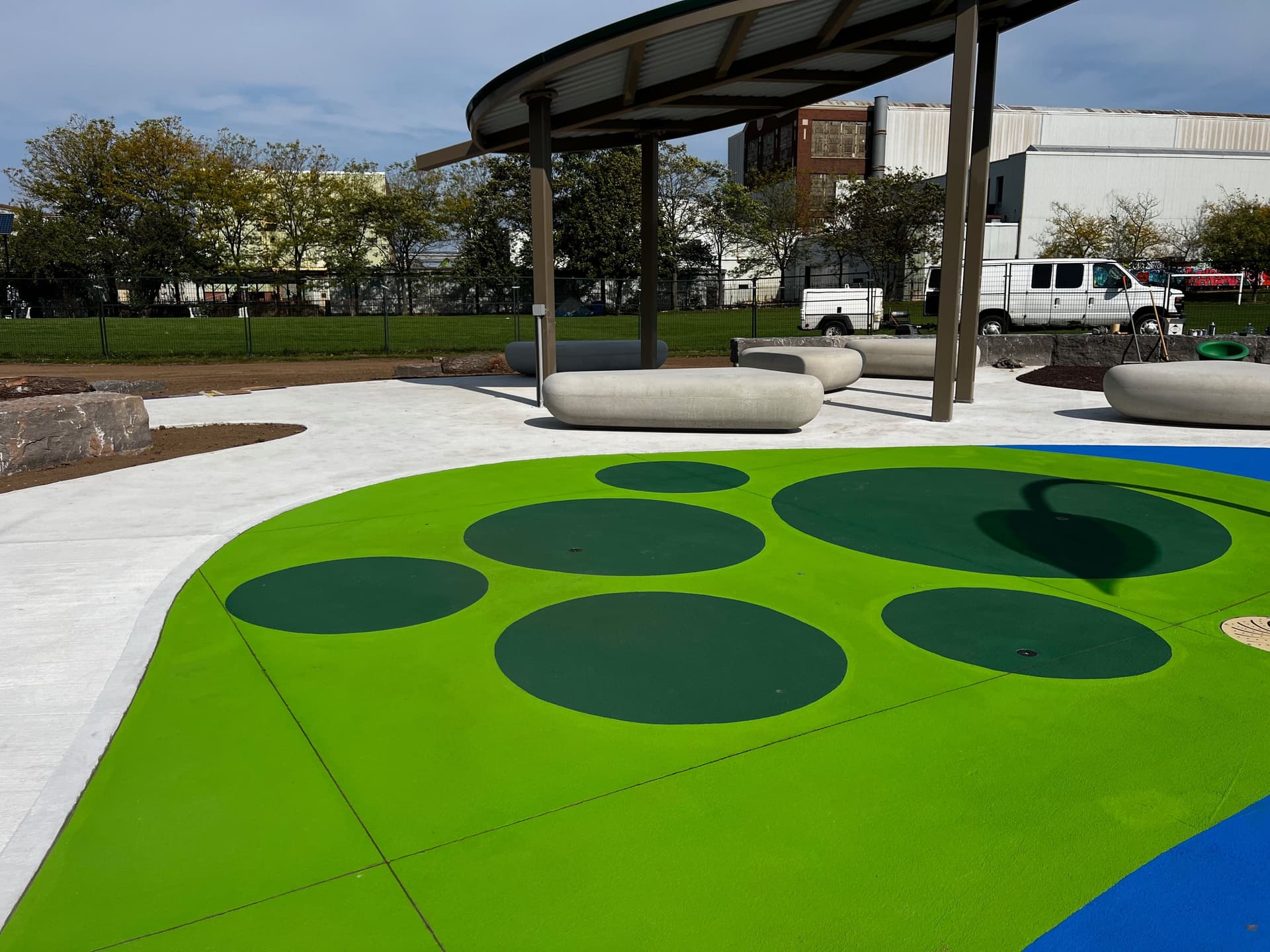 StreetBond pavement coating specified for long-life colour on asphalt and concrete — a plaza surface