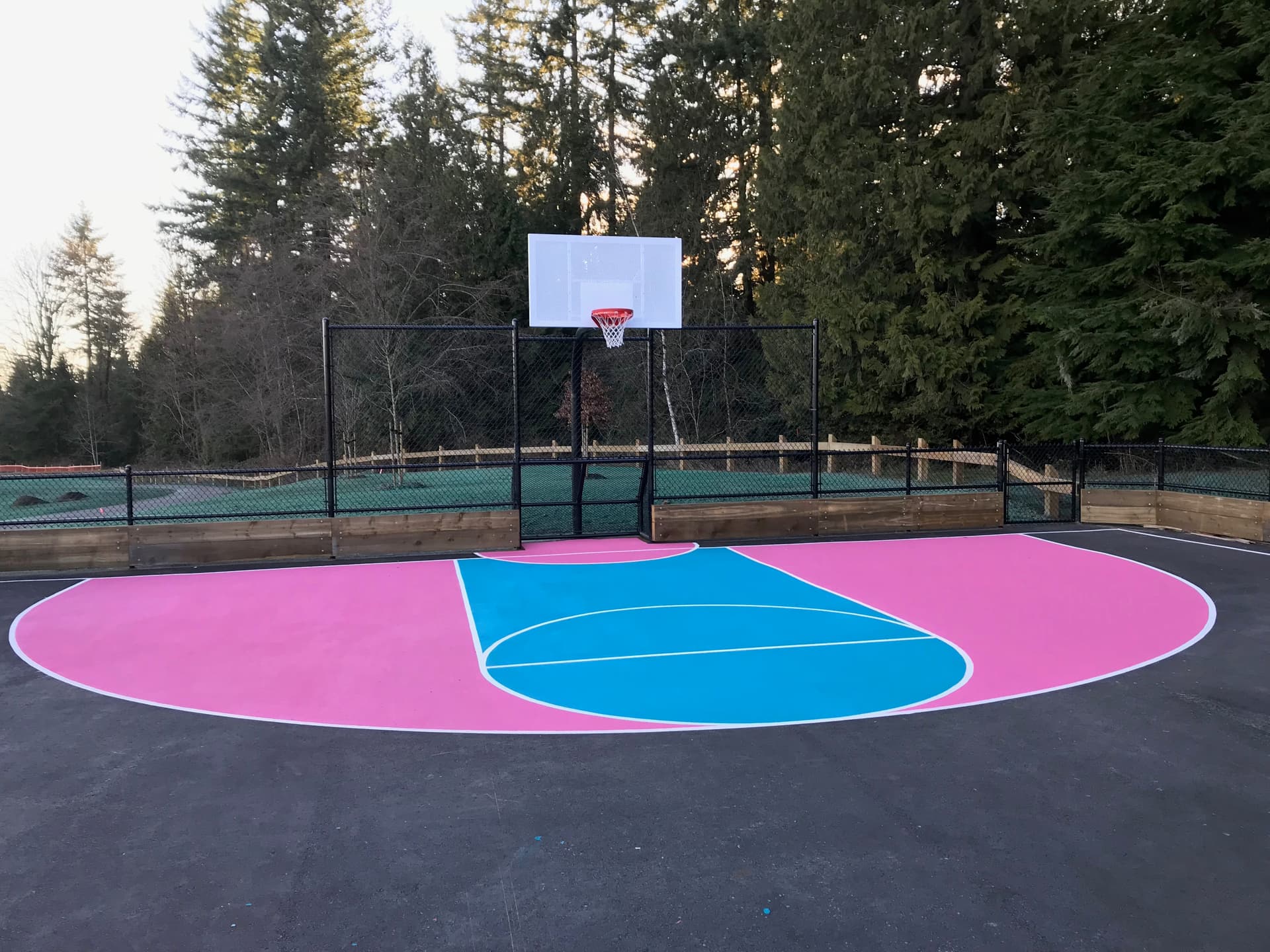 StreetBond pavement coating specified for long-life colour on asphalt and concrete — a coloured crosswalk