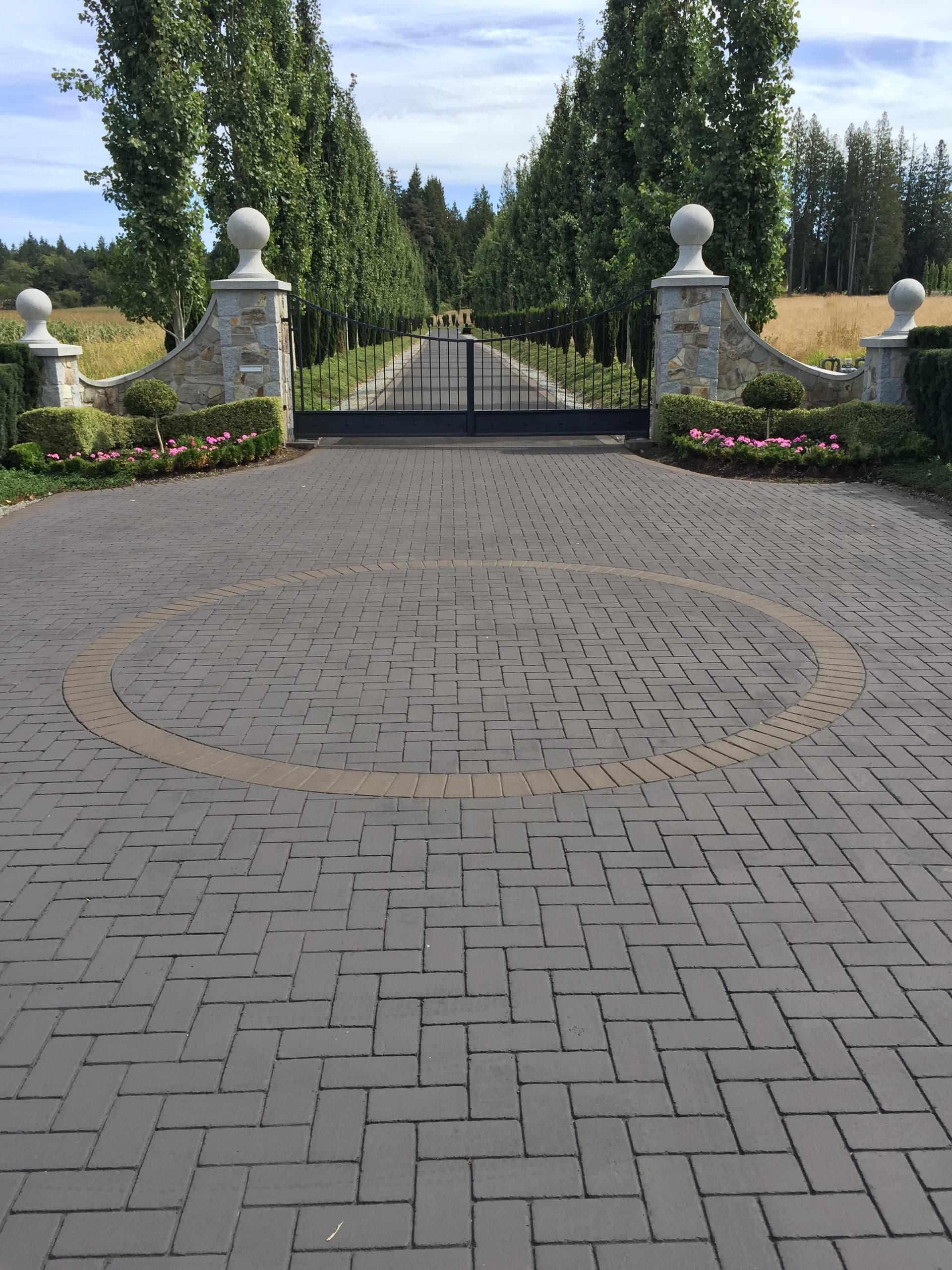 StreetPrint stamped asphalt decorative driveway — estate herringbone pattern with circular medallion, installed by HUB Surface Systems
