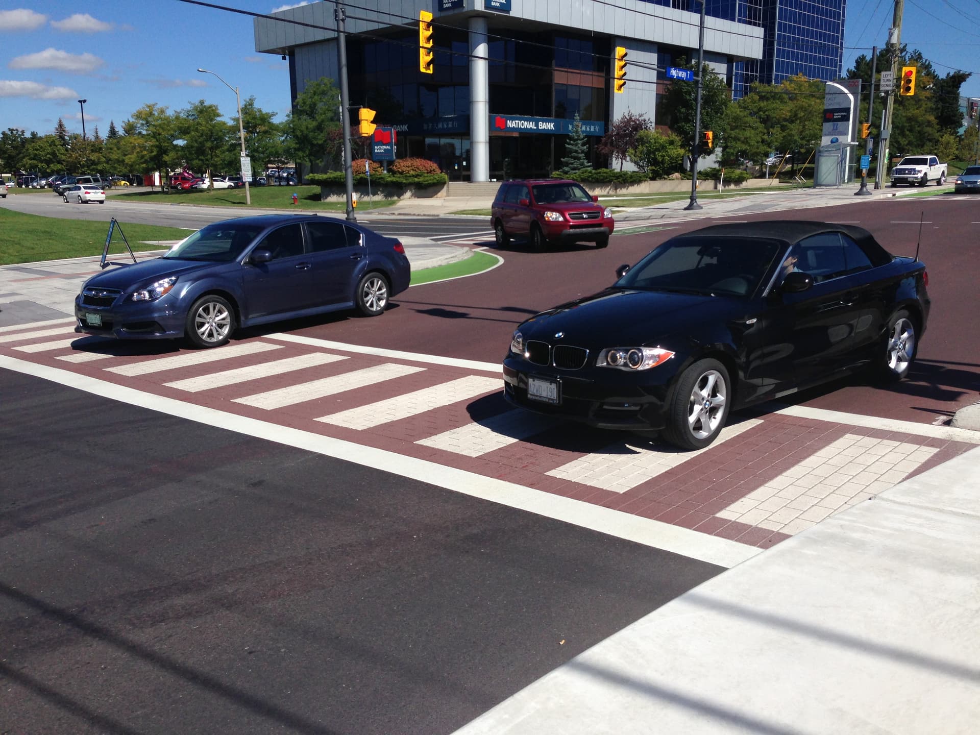 HUB Surface Systems decorative crosswalk — high-visibility pedestrian crossing at a residential collector road