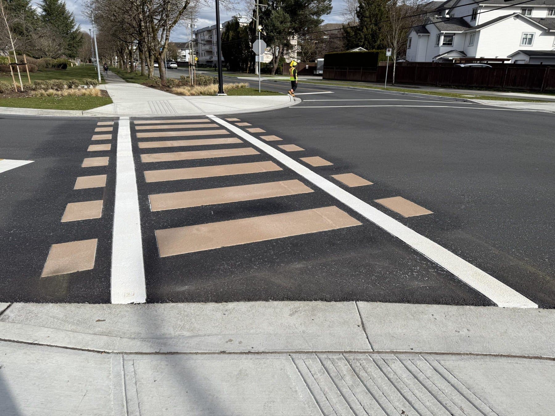 Decorative crosswalk installation in Langley, BC: high-visibility pedestrian crossing at a school zone