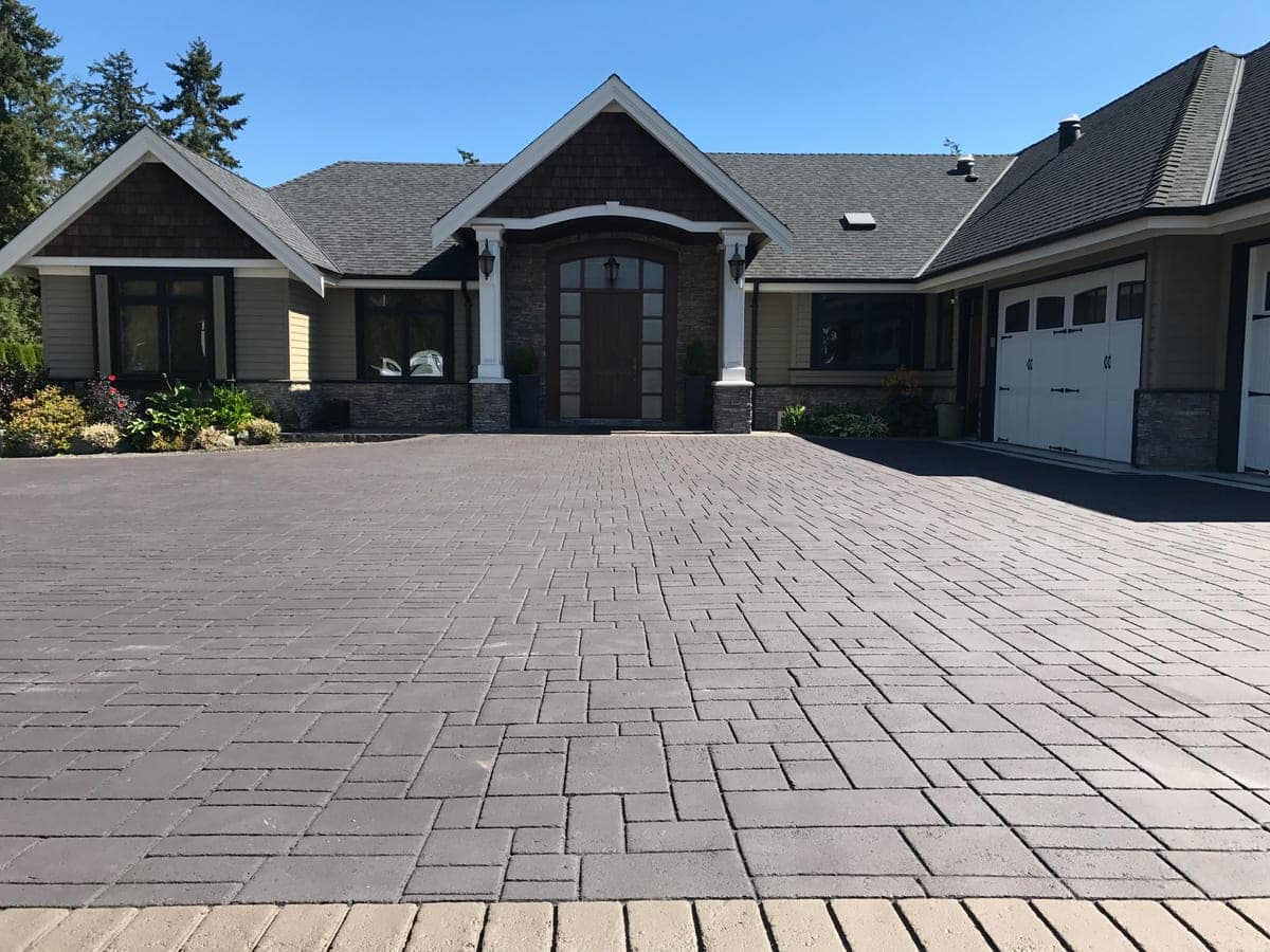 Stamped asphalt driveway specified for driveway surfacing with a paver appearance — a heritage neighbourhood property