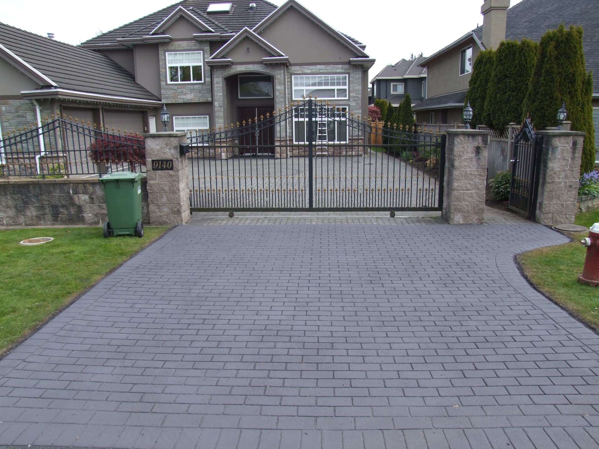 Stamped asphalt driveway at a suburban home in Canada — installed by HUB Surface Systems