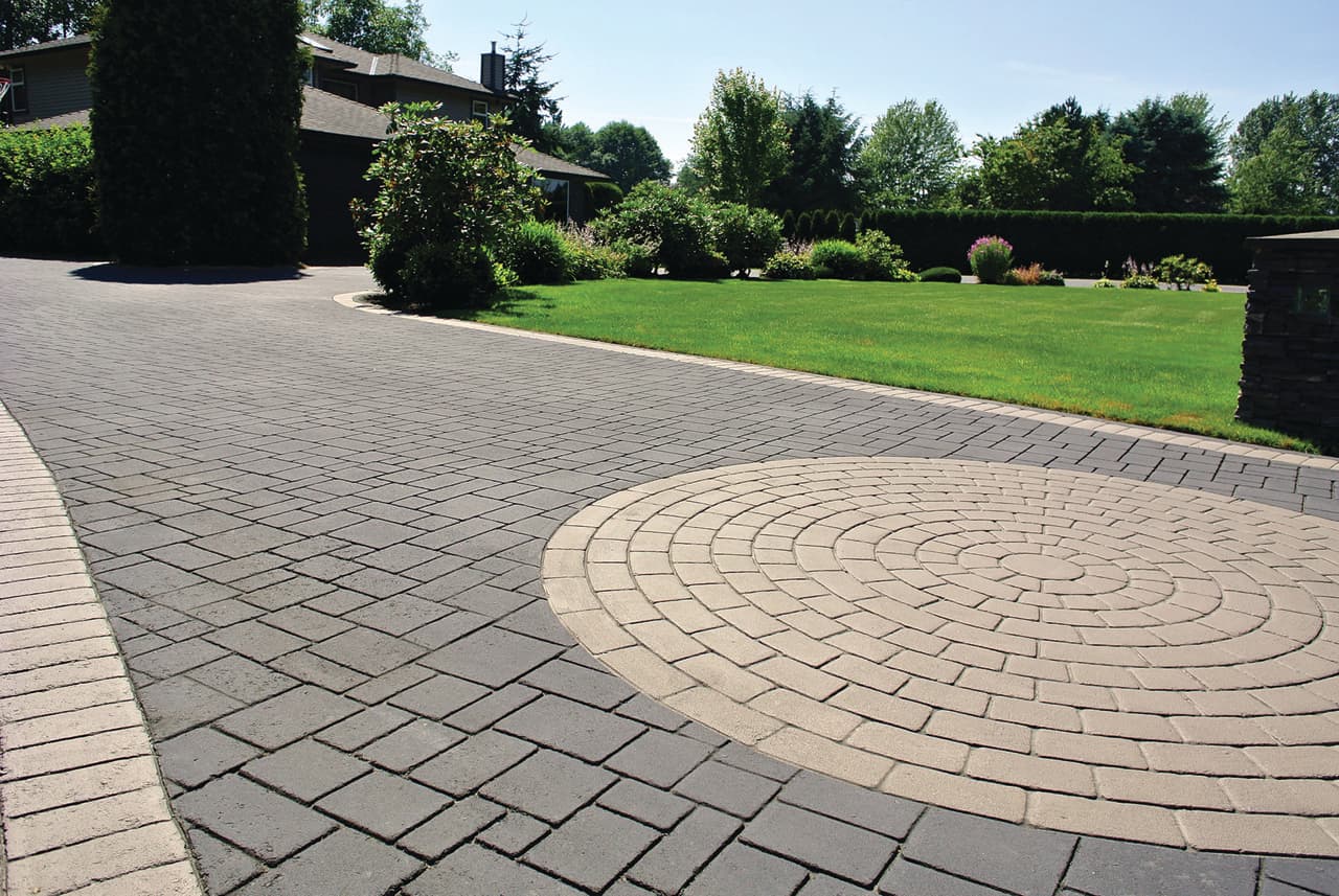 Stamped asphalt driveway at a residential street frontage in Canada — installed by HUB Surface Systems