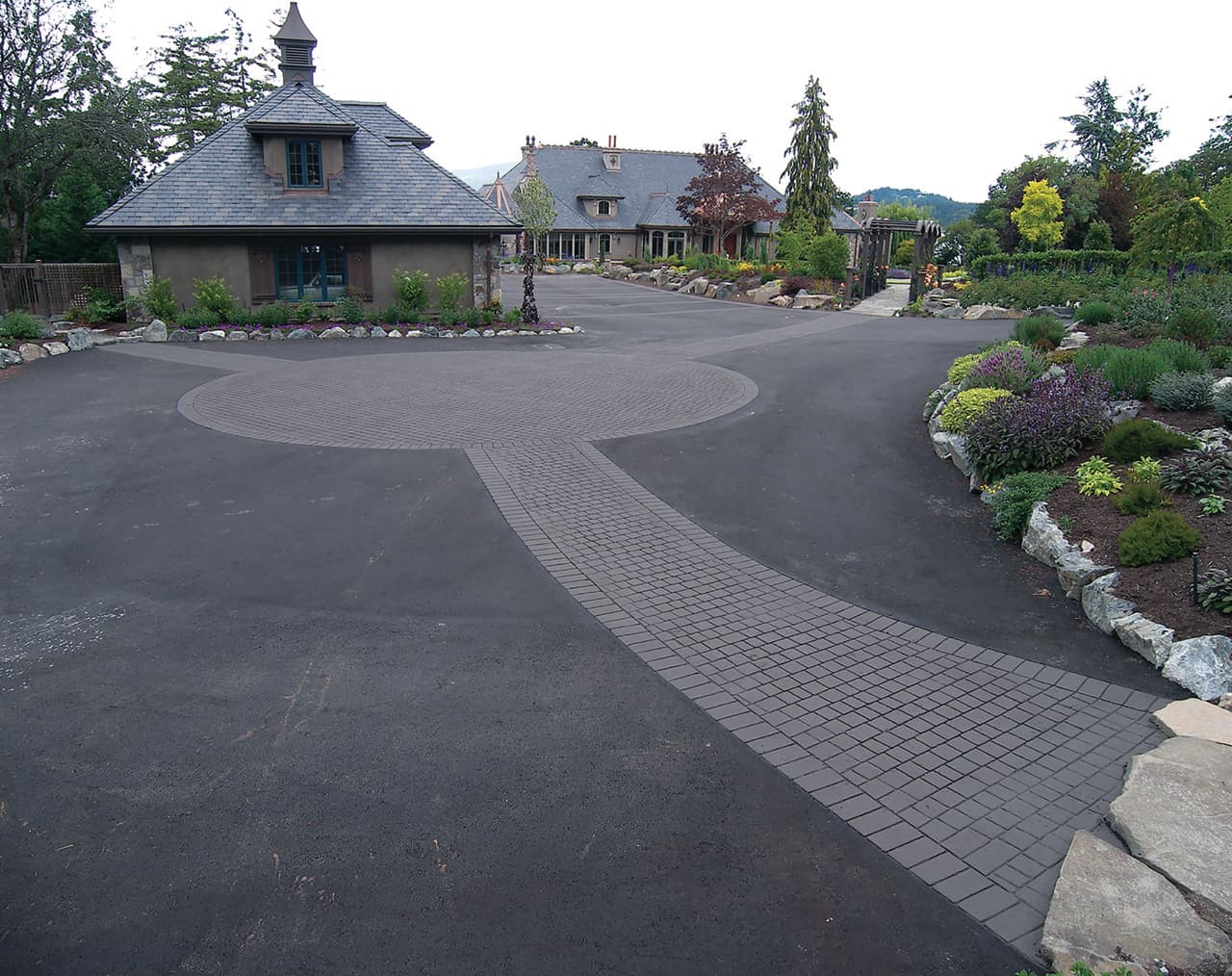 Stamped asphalt driveway at a new-build subdivision in Canada — installed by HUB Surface Systems