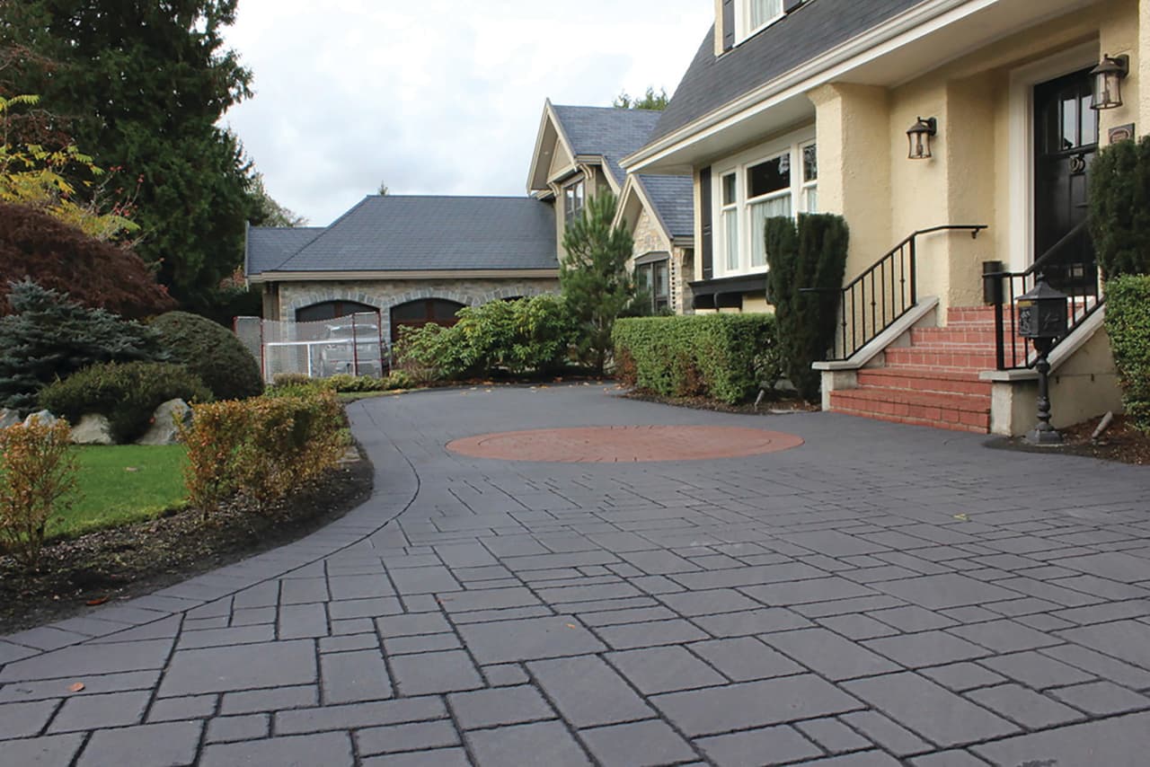 Stamped asphalt driveway at a suburban home in Canada — installed by HUB Surface Systems