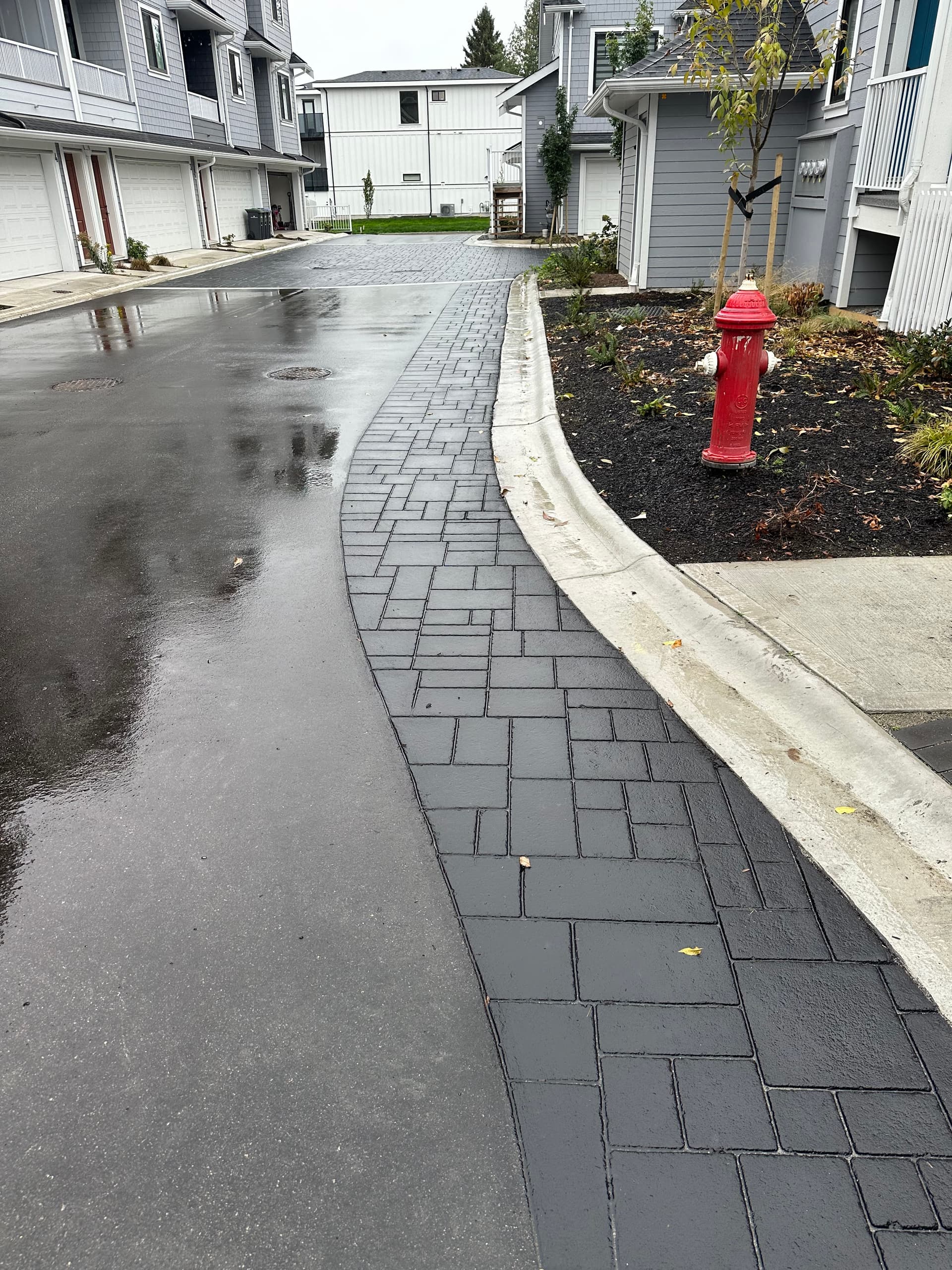 Townhome community paving at a condominium drive aisle in Canada — installed by HUB Surface Systems