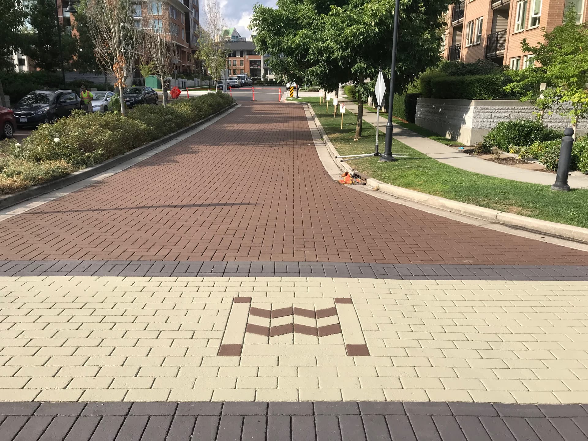 HUB Surface Systems townhome community paving — shared drive aisles and common areas at a strata common entrance