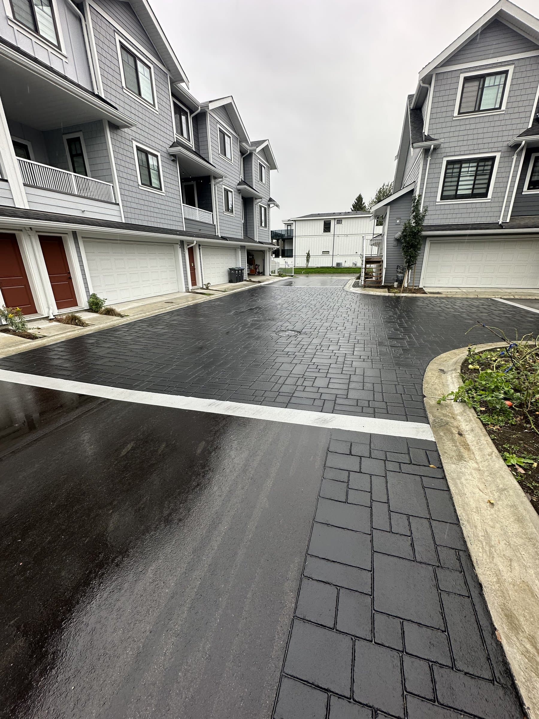 Townhome community paving installation in Canada: shared drive aisles and common areas at a strata common entrance