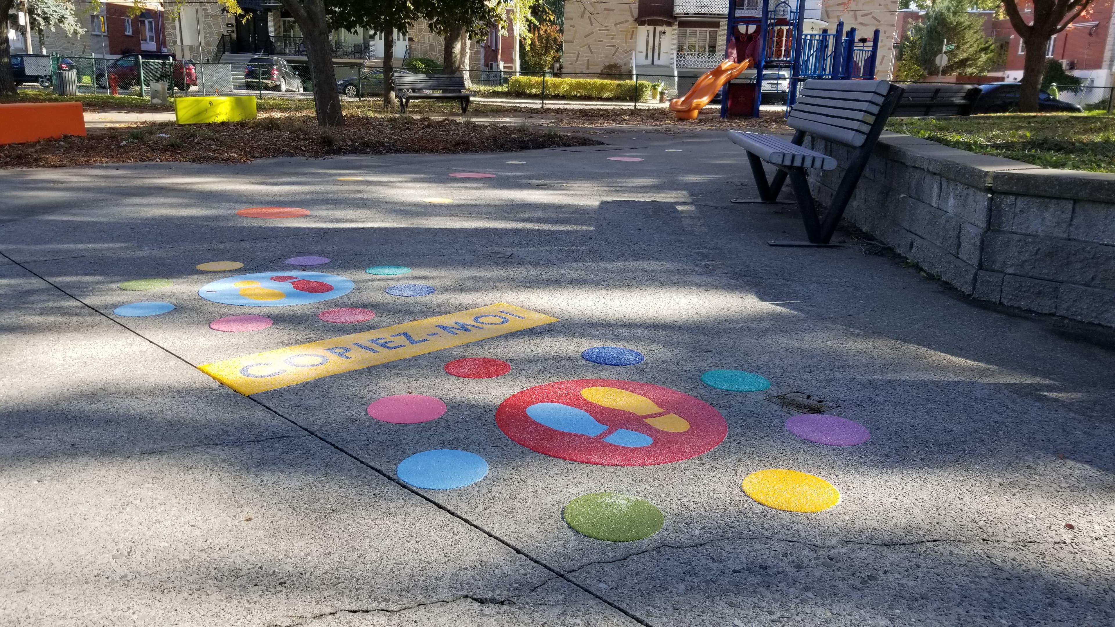 HUB Surface Systems DecoMark decorative pavement graphics — logos, art, and custom pavement design at a civic plaza