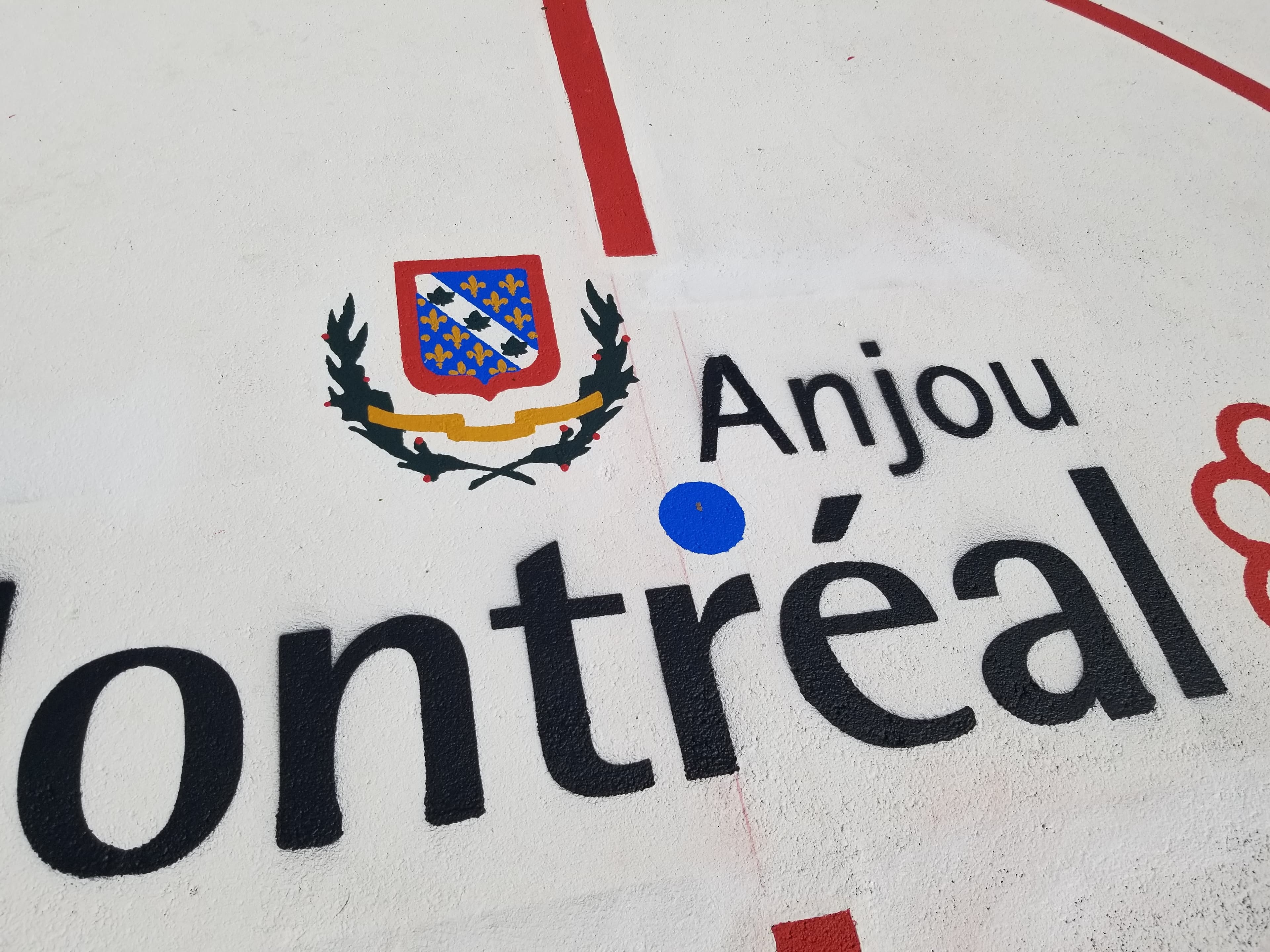 HUB Surface Systems DecoMark decorative pavement graphics — logos, art, and custom pavement design at a schoolyard