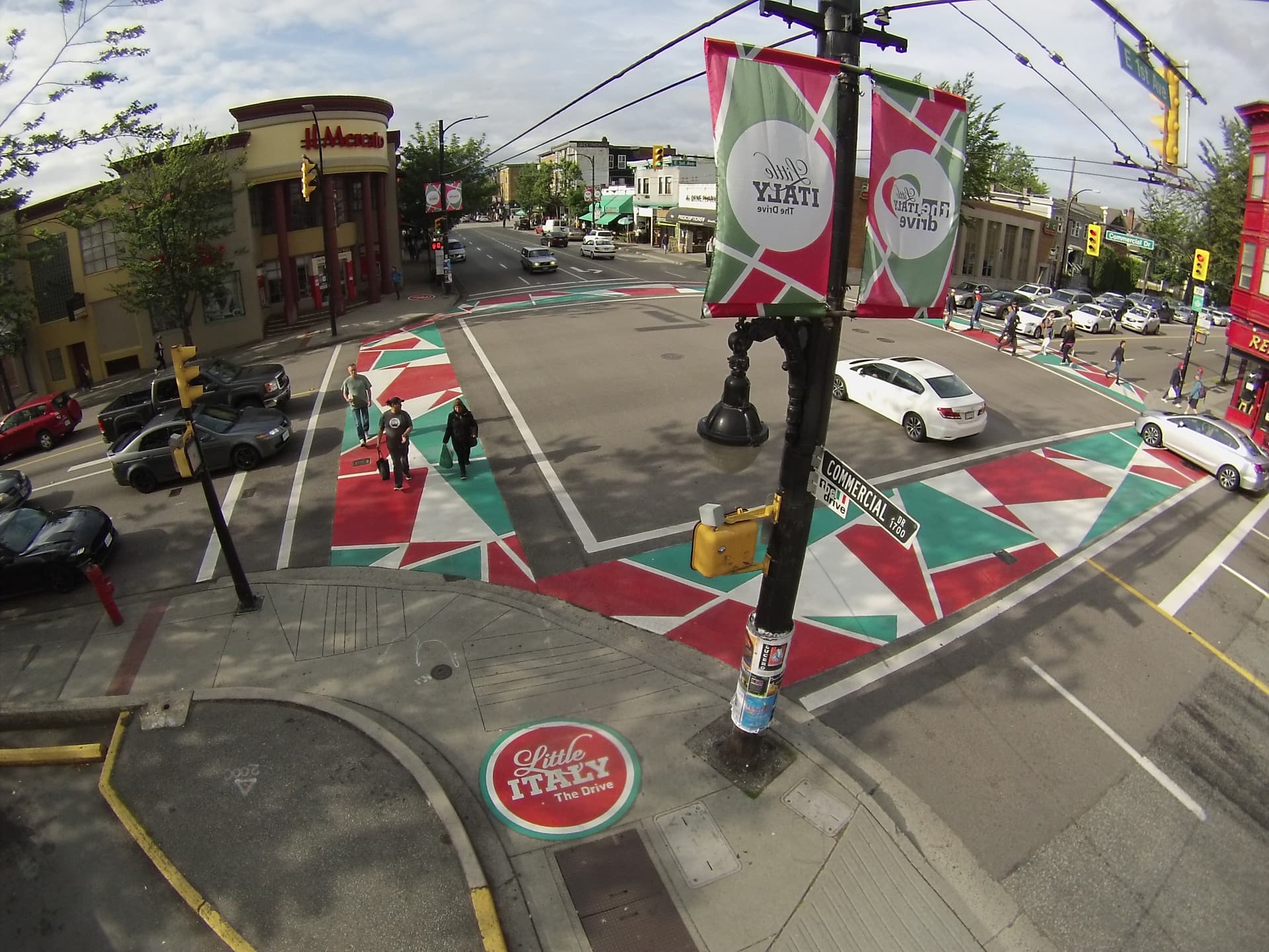 DecoMark decorative pavement graphics installation in Canada: logos, art, and custom pavement design at a rainbow crosswalk