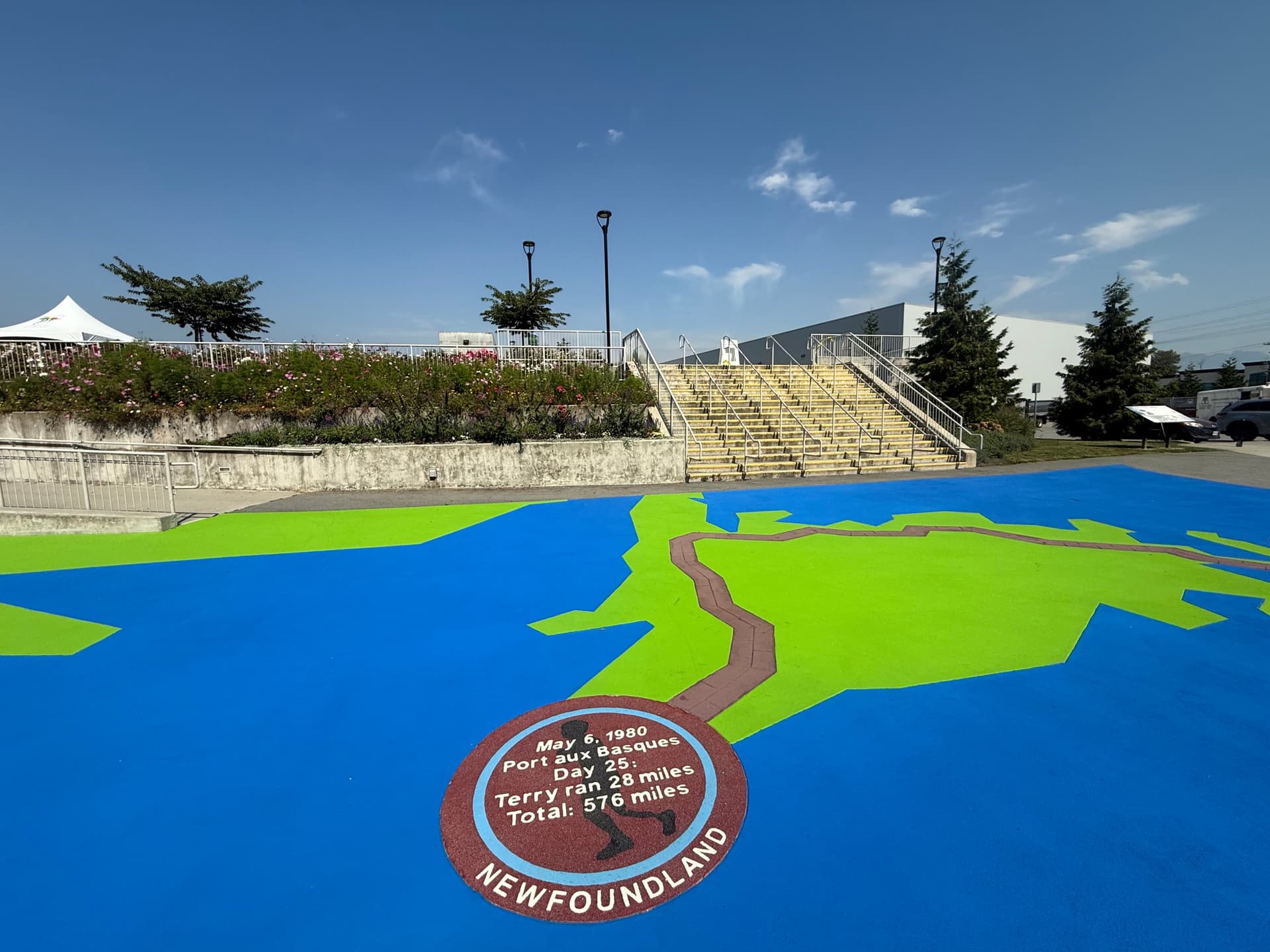 DecoMark decorative pavement graphics installation in Canada: logos, art, and custom pavement design at a cultural art crossing
