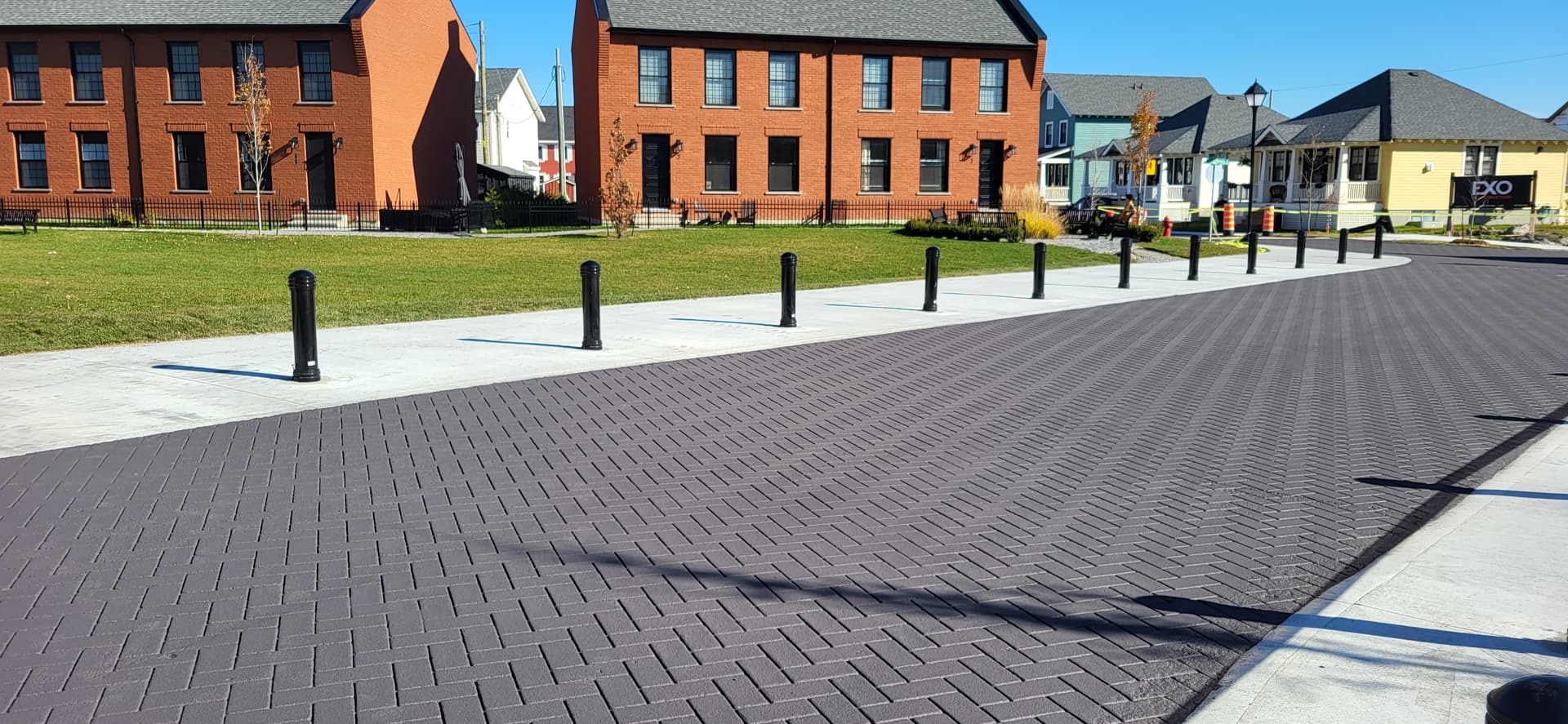 StreetPrint stamped asphalt installation in Canada: brick and cobblestone appearance in asphalt at a crosswalk