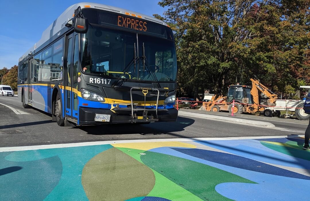 UBC and Musqueam crest design on Asphalt Crosswalk using TrafficPatterns 99Bline Vancouver BC Canada