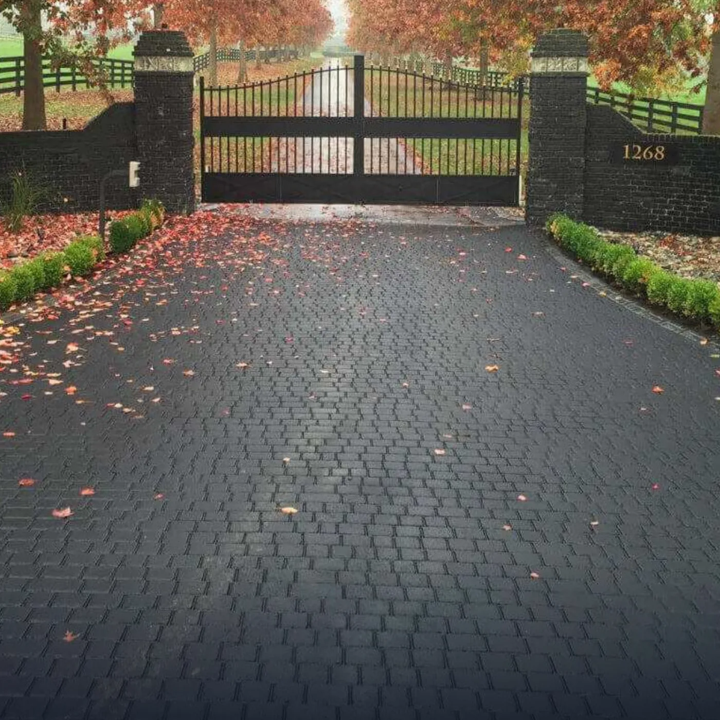A StreetPrint cobble driveway at a gated entrance