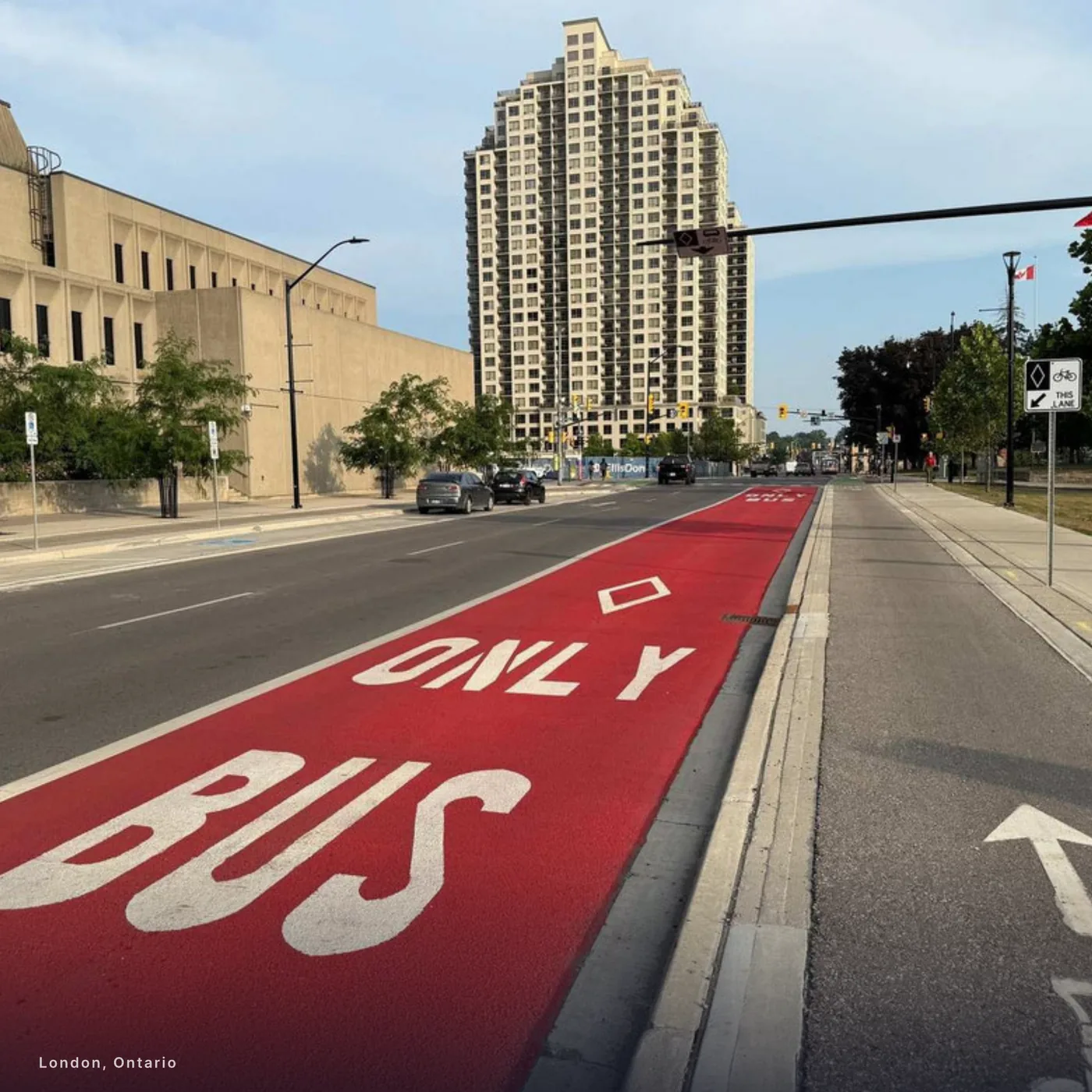 A red MMAX bus lane in London, Ontario