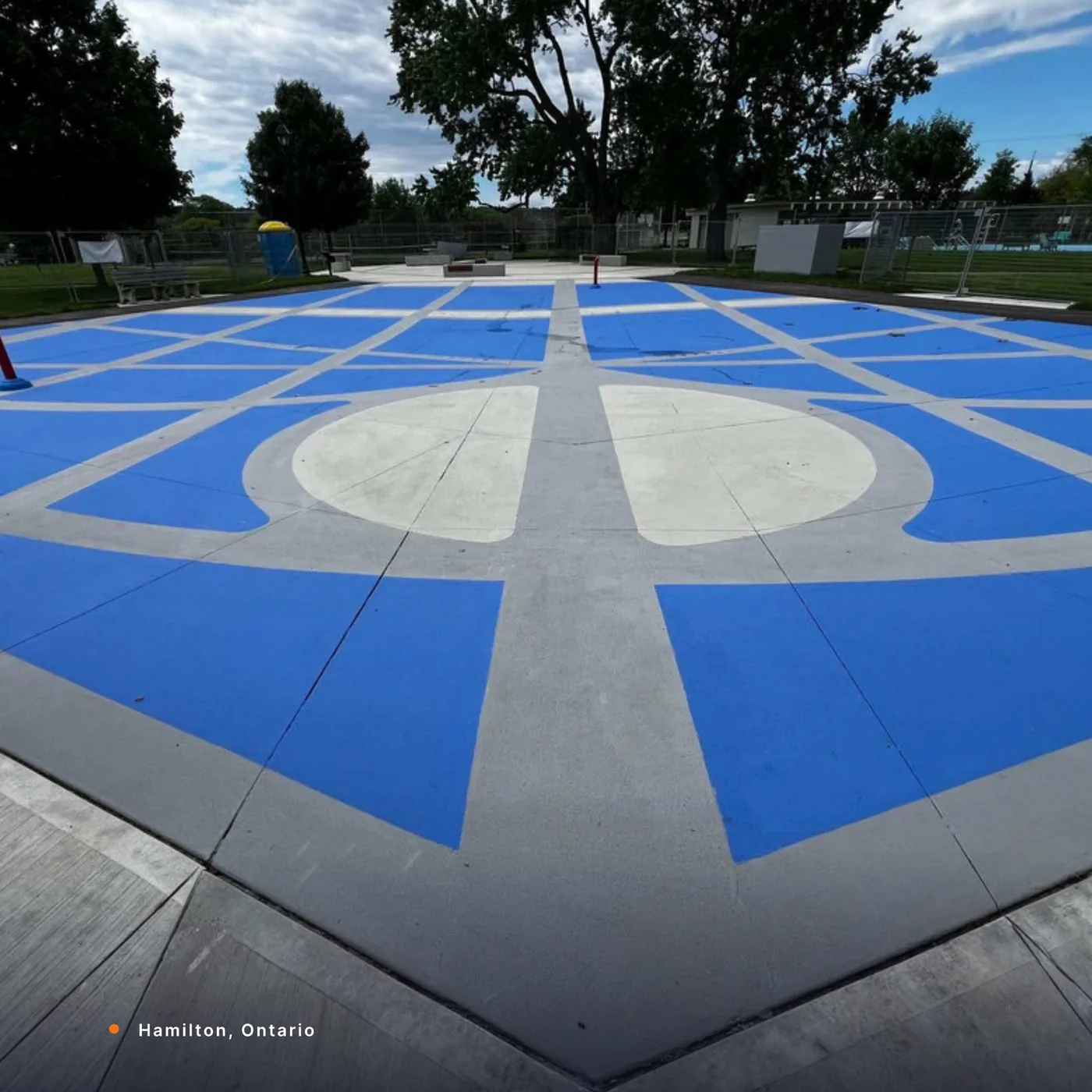 A blue StreetBond compass play pad in Hamilton, Ontario