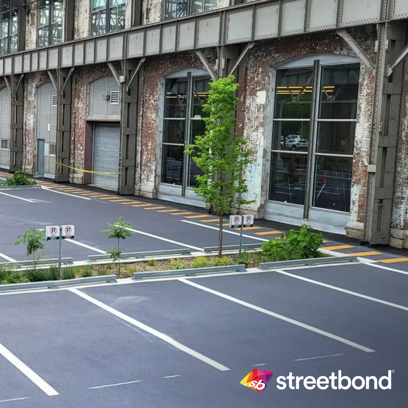 A slate-grey StreetBond parking lot inside a heritage industrial hall