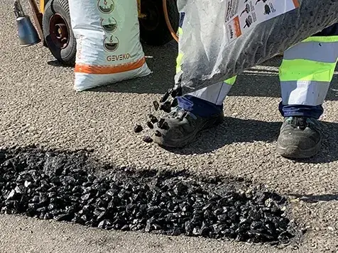 AggreFill poured from its bag into a pothole