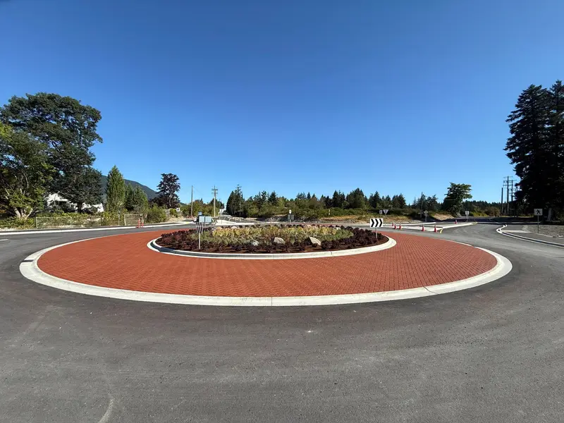 Red brick-pattern StreetPrint stamped asphalt on a roundabout apron
