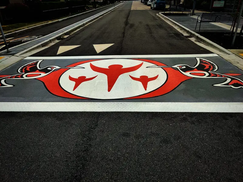 TrafficPatterns crosswalk carrying an Indigenous formline medallion