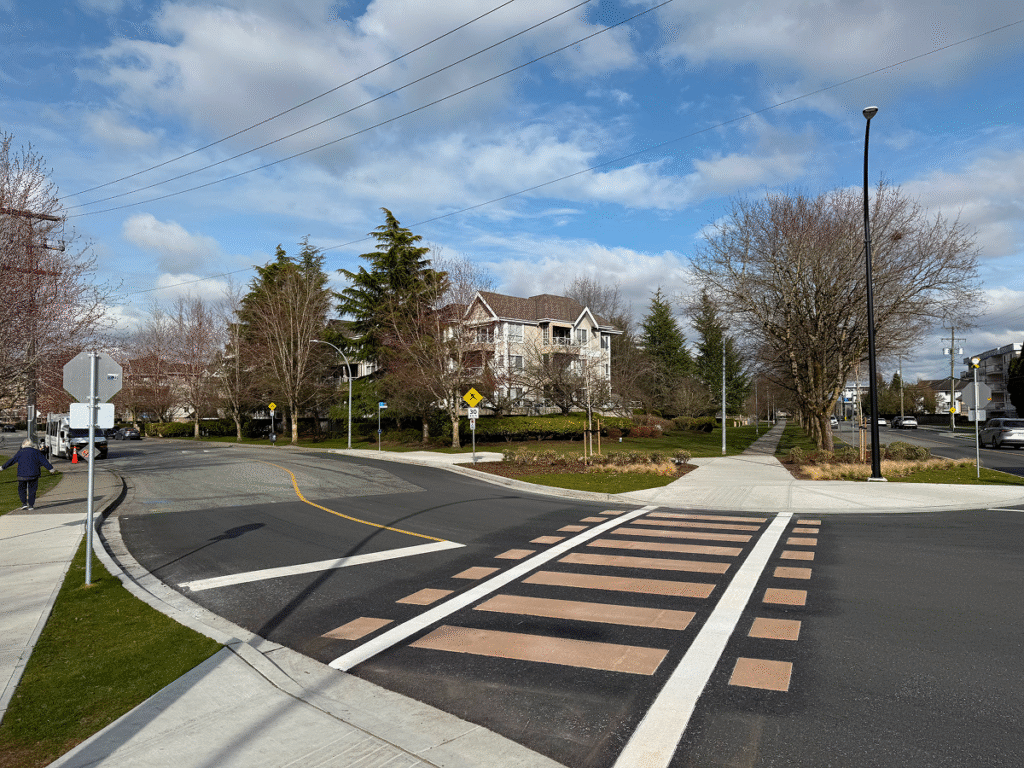 Railroad heritage TrafficPatterns crosswalk in Langley BC at Linwood Park with tan ties and white rail lines