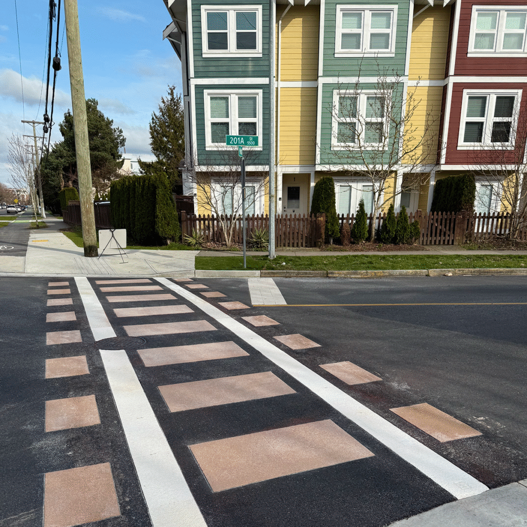 Langley City TrafficPatterns crosswalk designed to resemble railroad tracks using thermoplastic for heritage branding and safety