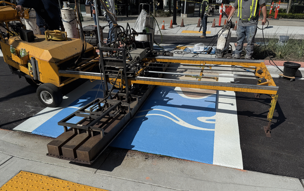TrafficPatterns crosswalk installation Seaside Stroll mural White Rock crews heat applying thermoplastic panels